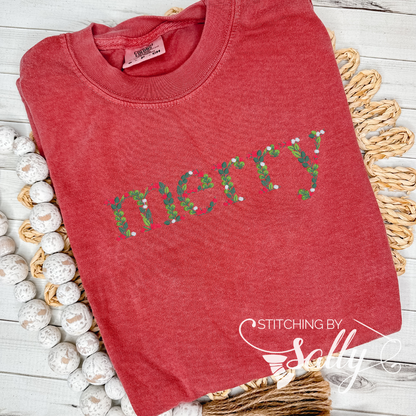 A red sweatshirt with "merry" embroidered in festive leaves and berries font, perfect for adding a touch of cheer to your wardrobe. Stitching by Sally 